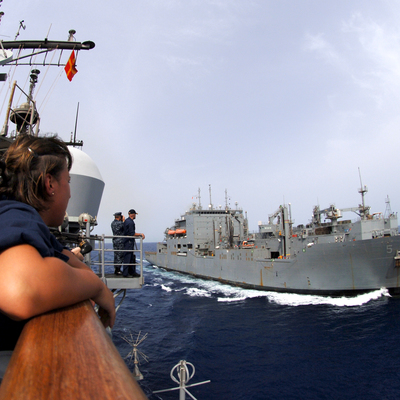 Main us navy 100603 n 0553r 071 lt. cmdr. samantha farriker watches from the port bridge wing as the military sealift command dry cargo and ammunition ship usns robert e. peary  t ake 5  pulls along side